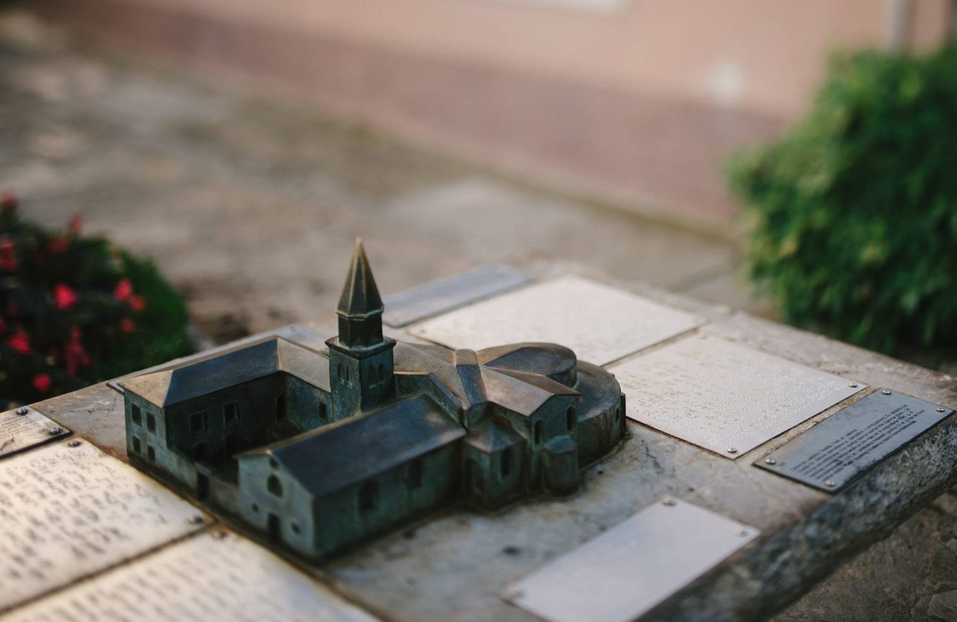 A detailed small bronze model of a historic church